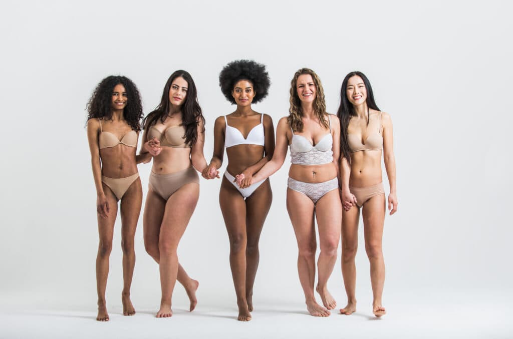 Group of women with different body and ethnicity posing together